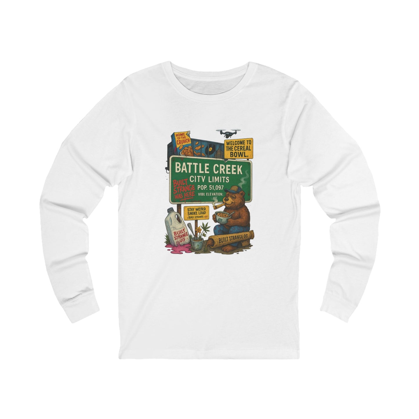 Pour up the crunch and light one up — the Battle Creek “Built Strange Was Here” long sleeve tee celebrates the cereal capital in true Built Strange fashion. Featuring the iconic bear kicking back with a bowl and a smoke, this design mixes nostalgia, humor, and that unmistakable Midwest chill.
Premium jersey long sleeve tee
Soft, breathable cotton with a relaxed fit
Full-color front print with vivid detail
Perfect for laid-back days or layered looks
Designed by Built Strange Apparel