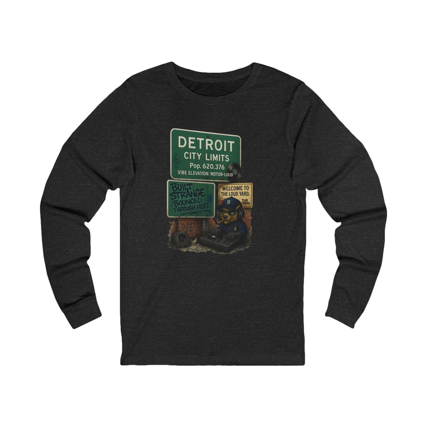 From the Motor City to the loud yard — the Detroit “Built Strange Bounced Through Here” long sleeve tee captures the soul of sound, smoke, and street rhythm. Featuring the Built Strange DJ bear spinning under the iconic Detroit city sign, this one’s made for movers, creators, and grinders who keep it loud.
Premium jersey long sleeve tee
Mid-weight cotton with soft, all-day comfort
High-quality full-color print with crisp detail
Streetwear fit built for any season
Designed by Built Strange Apparel