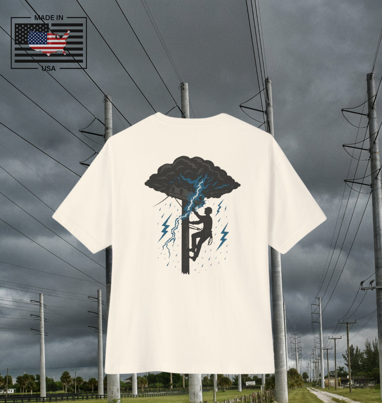 Power in the storm. This bold Built Strange tradewear design captures the grit and courage of the lineworker climbing into lightning and rain to keep the world lit.