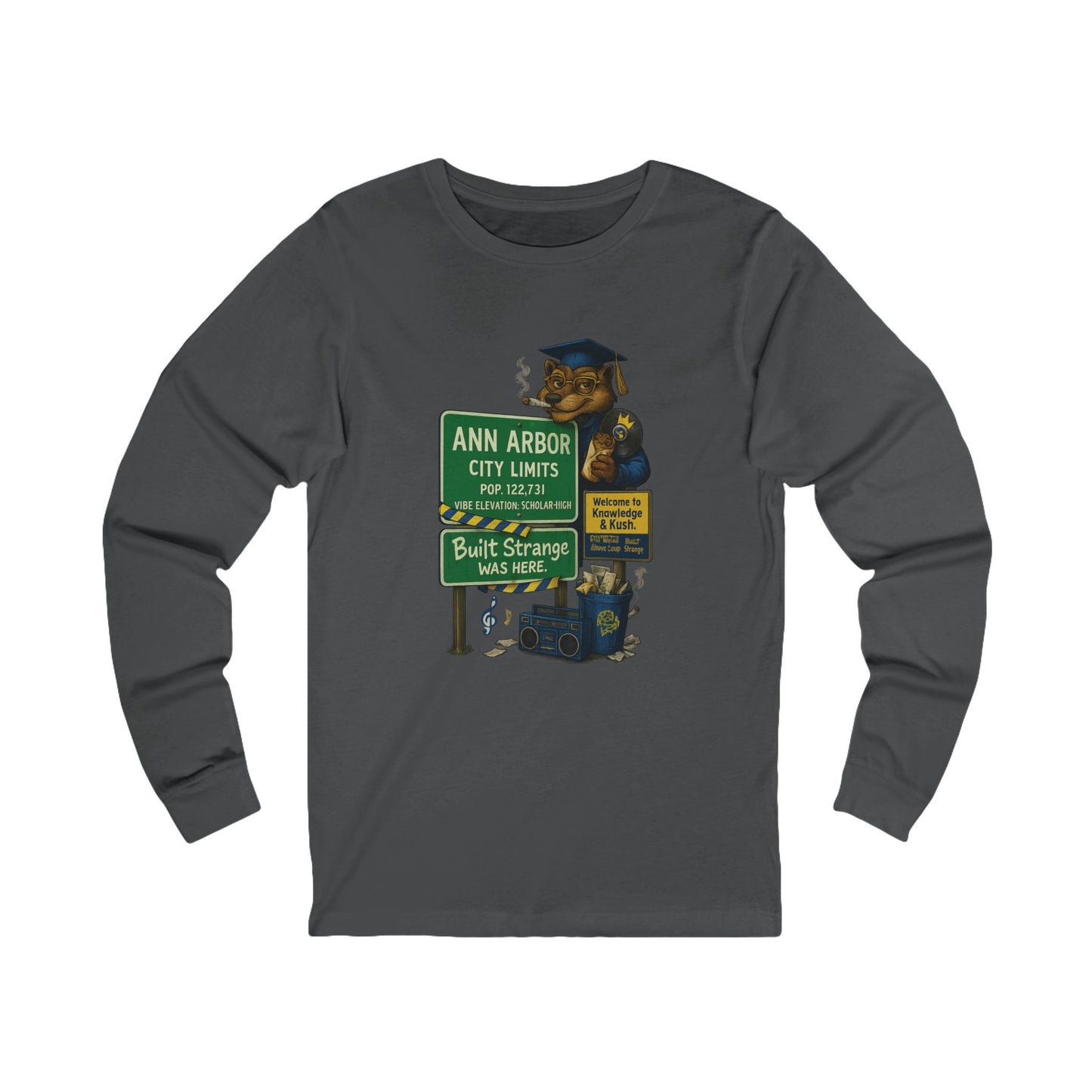 Smart smoke meets scholar energy. The Ann Arbor “Built Strange Was Here” long sleeve tee pays homage to Michigan’s high-minded city — where creativity, knowledge, and kush collide. Featuring the Built Strange grad bear posted up at city limits, this design keeps intellect and chill on the same frequency.



Premium jersey long sleeve tee

Soft, mid-weight cotton for all-day comfort

Full-color front graphic with crisp detail

Perfect for cool nights or layered streetwear looks

Designed by Built Strange App