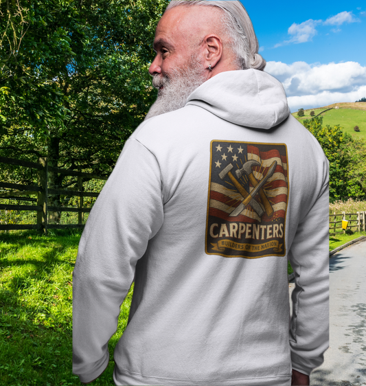 Wear your trade with pride.

This Built Strange hoodie features a bold back design with:

American Flag backdrop waving strong.

Crossed hammer + chisel — the timeless carpenter’s tools.

Banner: “Builders of the Nation,” honoring the craft that built America.

Premium fleece construction for durability and comfort.

A perfect mix of patriotism, streetwear edge, and working-class grit. Built Strange 24 Series – made for those who shape the future with their hands.