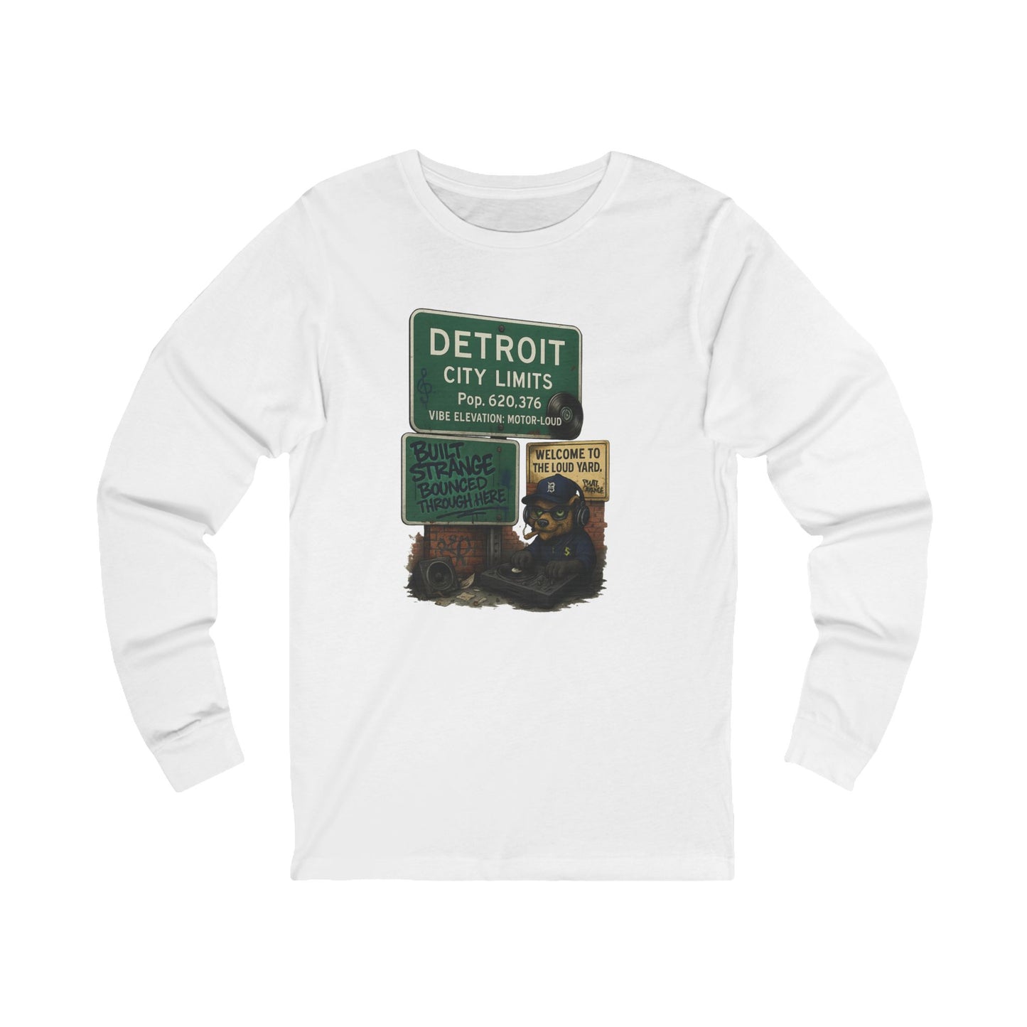 From the Motor City to the loud yard — the Detroit “Built Strange Bounced Through Here” long sleeve tee captures the soul of sound, smoke, and street rhythm. Featuring the Built Strange DJ bear spinning under the iconic Detroit city sign, this one’s made for movers, creators, and grinders who keep it loud.



Premium jersey long sleeve tee

Mid-weight cotton with soft, all-day comfort

High-quality full-color print with crisp detail

Streetwear fit built for any season

Designed by Built Strange Apparel