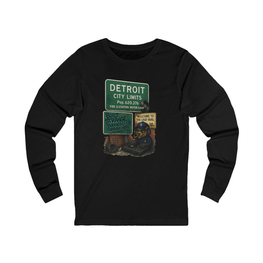 From the Motor City to the loud yard — the Detroit “Built Strange Bounced Through Here” long sleeve tee captures the soul of sound, smoke, and street rhythm. Featuring the Built Strange DJ bear spinning under the iconic Detroit city sign, this one’s made for movers, creators, and grinders who keep it loud.



Premium jersey long sleeve tee

Mid-weight cotton with soft, all-day comfort

High-quality full-color print with crisp detail

Streetwear fit built for any season

Designed by Built Strange Apparel