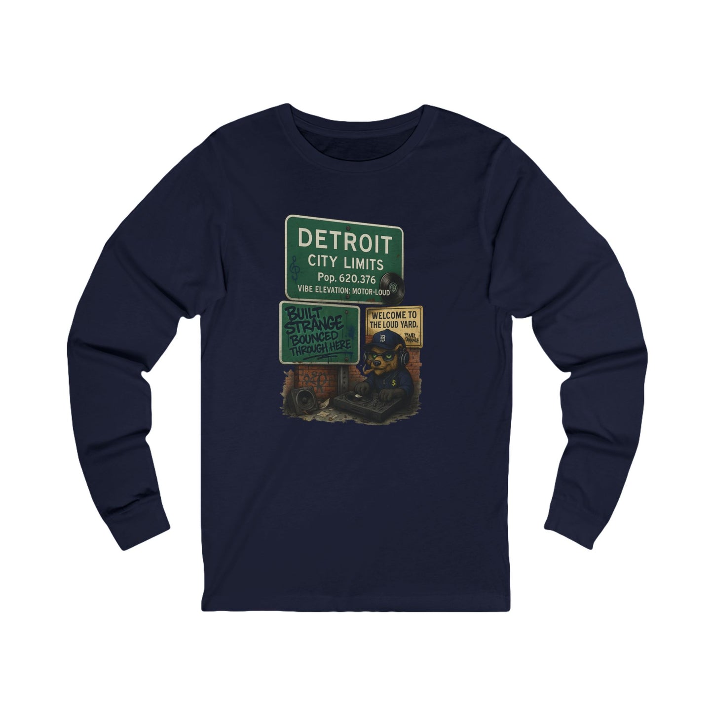 From the Motor City to the loud yard — the Detroit “Built Strange Bounced Through Here” long sleeve tee captures the soul of sound, smoke, and street rhythm. Featuring the Built Strange DJ bear spinning under the iconic Detroit city sign, this one’s made for movers, creators, and grinders who keep it loud.



Premium jersey long sleeve tee

Mid-weight cotton with soft, all-day comfort

High-quality full-color print with crisp detail

Streetwear fit built for any season

Designed by Built Strange Apparel