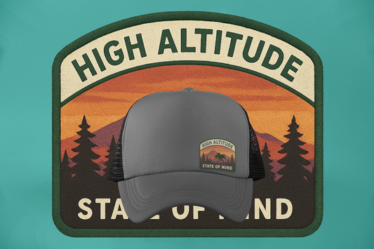 Elevate your frequency with the High Altitude State trucker cap — a smooth blend of retro outdoor vibes and cannabis culture. Featuring a sunset mountain patch, pine silhouettes, and a crisp cannabis leaf drifting through the alpine dusk, this design speaks to the heads who roam above the noise. Finished with forest green trim and foam front, this hat isn’t just a statement — it’s a lifestyle.
Built Strange® presents: Da Truckas.
Certified Strange. Always lifted.

This six-panel trucker cap with a mesh back
